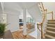 Open concept living area with hardwood floors that flows to the staircase and kitchen at 1634 Ponce De Leon Ne Ave # 208, Atlanta, GA 30307