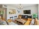 Open concept living room featuring hardwood floors, comfortable seating, and abundant natural light at 1634 Ponce De Leon Ne Ave # 208, Atlanta, GA 30307