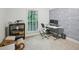 This office features two monitors, a wallpapered accent wall, and natural light at 1634 Ponce De Leon Ne Ave # 208, Atlanta, GA 30307