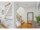 Classic staircase with wood railings and carpeted steps leading to the upper level at 1634 Ponce De Leon Ne Ave # 208, Atlanta, GA 30307