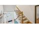 Carpeted stairs with white wood railing leading up from the entrance of the home at 1634 Ponce De Leon Ne Ave # 208, Atlanta, GA 30307