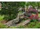 A stone water feature with lilly pads and surrounding landscaping adds value to this property at 1634 Ponce De Leon Ne Ave # 208, Atlanta, GA 30307