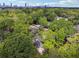 Expansive aerial view overlooking a neighborhood with lush greenery and the city skyline in the distance at 183 Whitefoord Ne Ave, Atlanta, GA 30307