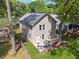 View of the backyard with well-maintained lawn, cozy seating, and a wooden fence at 183 Whitefoord Ne Ave, Atlanta, GA 30307