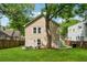 Large, lush backyard with patio and mature trees behind the home at 183 Whitefoord Ne Ave, Atlanta, GA 30307
