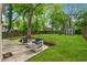 Spacious backyard featuring patio furniture, green grass, and a shed at 183 Whitefoord Ne Ave, Atlanta, GA 30307