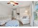 Neutral toned bedroom featuring a crib, armchair, and natural light at 183 Whitefoord Ne Ave, Atlanta, GA 30307