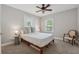 Bedroom features neutral decor with a ceiling fan, plush carpet, and natural light at 183 Whitefoord Ne Ave, Atlanta, GA 30307