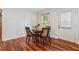 Cozy dining area with a wooden table and hardwood floors at 183 Whitefoord Ne Ave, Atlanta, GA 30307
