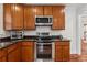 Well-equipped kitchen with stainless steel oven and microwave appliances at 183 Whitefoord Ne Ave, Atlanta, GA 30307