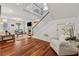 Open-concept living room with hardwood floors and a staircase at 183 Whitefoord Ne Ave, Atlanta, GA 30307