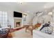 Cozy living room featuring a fireplace, hardwood floors, and staircase at 183 Whitefoord Ne Ave, Atlanta, GA 30307
