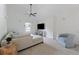 Bright living room with neutral walls, vaulted ceiling, and comfortable seating area at 183 Whitefoord Ne Ave, Atlanta, GA 30307
