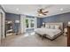 Spacious bedroom with blue walls, ceiling fan, and an abundance of natural light at 183 Whitefoord Ne Ave, Atlanta, GA 30307