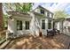 Inviting wood deck with outdoor seating, French doors, and a view of the landscaped backyard at 2840 Alpine Rd, Atlanta, GA 30305