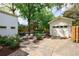 A charming backyard with a patio, detached garage, and well-manicured landscaping at 2840 Alpine Rd, Atlanta, GA 30305