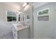 Elegant bathroom with a double vanity, decorative tile floor and a glass-enclosed shower with a window at 2840 Alpine Rd, Atlanta, GA 30305