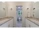 Bright bathroom with double sinks, granite countertops and modern lighting at 2840 Alpine Rd, Atlanta, GA 30305