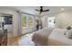 Bright bedroom featuring hardwood floors, a ceiling fan, walk-in closet and windows for natural light at 2840 Alpine Rd, Atlanta, GA 30305