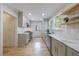 Bright kitchen featuring stainless steel appliances, floating wood shelves, and lots of storage at 2840 Alpine Rd, Atlanta, GA 30305