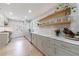 Bright kitchen featuring stainless steel appliances, floating wood shelves, and lots of storage at 2840 Alpine Rd, Atlanta, GA 30305