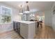 This is a kitchen island that features a marble countertop and two wine coolers at 2840 Alpine Rd, Atlanta, GA 30305