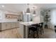 Bright kitchen with stainless steel appliances, center island with seating, and stylish pendant lighting at 2840 Alpine Rd, Atlanta, GA 30305