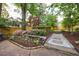 Beautifully landscaped backyard with stone steps and a lush garden at 2840 Alpine Rd, Atlanta, GA 30305
