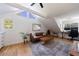 Bright bonus room with large windows, a comfy sofa and an office area at 2840 Alpine Rd, Atlanta, GA 30305
