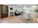 Cozy living room with bay window, hardwood floors, and comfortable seating arrangement at 2840 Alpine Rd, Atlanta, GA 30305