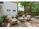 Outdoor patio featuring comfortable seating, landscaping, and serene backyard views at 2840 Alpine Rd, Atlanta, GA 30305