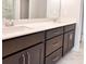 Bathroom featuring dual sinks, quartz countertops, and modern cabinetry at 4090 Cavalier Way, Duluth, GA 30097
