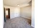 Bedroom with neutral walls and carpeting, featuring a closet and entrance at 4090 Cavalier Way, Duluth, GA 30097