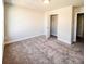 Bedroom featuring plush carpeting, neutral walls, and open closet at 4090 Cavalier Way, Duluth, GA 30097