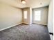 Bedroom with neutral walls, plush carpeting, and lots of natural light at 4090 Cavalier Way, Duluth, GA 30097