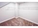 Walk-in closet featuring shelving and carpet at 4090 Cavalier Way, Duluth, GA 30097
