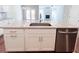 Kitchen island featuring granite countertop, undermount sink, and stainless steel dishwasher at 4090 Cavalier Way, Duluth, GA 30097