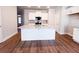 Large kitchen island with granite counters, white cabinets and stainless steel appliances at 4090 Cavalier Way, Duluth, GA 30097