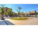 Town square with lawn, public seating, and decorative art and buildings at 4090 Cavalier Way, Duluth, GA 30097