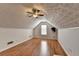 Finished attic featuring vaulted ceiling and wood-look flooring at 755 James Ridge Dr, Lawrenceville, GA 30045