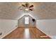 Finished attic featuring vaulted ceiling and wood-look flooring at 755 James Ridge Dr, Lawrenceville, GA 30045