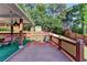 Outdoor deck features a covered dining area, ceiling fans, gas heater, and wooden fence at 755 James Ridge Dr, Lawrenceville, GA 30045