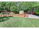 Spacious backyard featuring a terraced garden and shed, offering a serene outdoor retreat at 755 James Ridge Dr, Lawrenceville, GA 30045