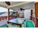 Backyard deck offering a covered dining space with ceiling fans overlooking the lawn at 755 James Ridge Dr, Lawrenceville, GA 30045