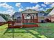 Large backyard features a covered deck perfect for entertaining and enjoying outdoor living at 755 James Ridge Dr, Lawrenceville, GA 30045