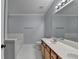 Bathroom with double sink vanity, large mirror, and separate tub and shower at 755 James Ridge Dr, Lawrenceville, GA 30045