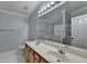 Bathroom with double sinks, vanity, and large mirror with lighting at 755 James Ridge Dr, Lawrenceville, GA 30045