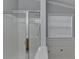 Bathroom with a shower and bathtub combination and window for natural lighting at 755 James Ridge Dr, Lawrenceville, GA 30045