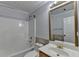 Bathroom with tub-shower combo, vanity, and mirror at 755 James Ridge Dr, Lawrenceville, GA 30045