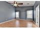 Bedroom featuring high ceilings, a ceiling fan, and two windows with valences at 755 James Ridge Dr, Lawrenceville, GA 30045
